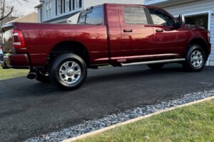 Red pick up truck cleaned by Game Auto Detailing parked on driveway